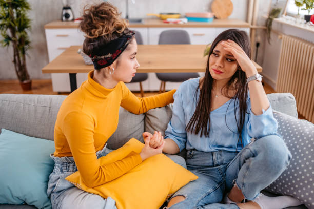 istock Young Woman Comforting Her Sad Friend 1468507182