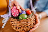 An Easter Egg Basket With Eggs
