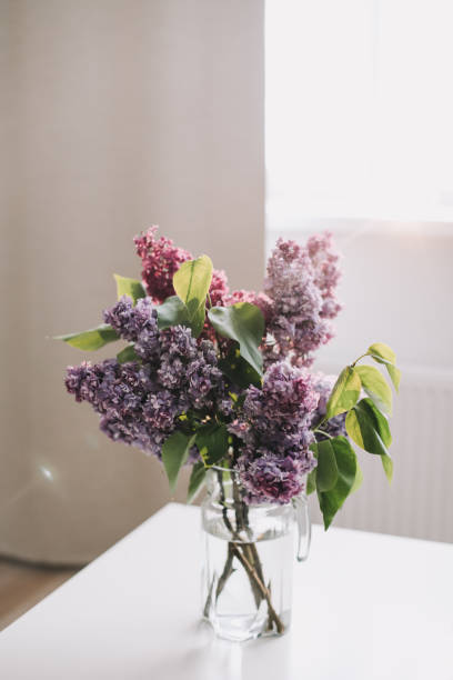 istock Home interior decor, bouquet of lilacs in a vase on table 1468509929