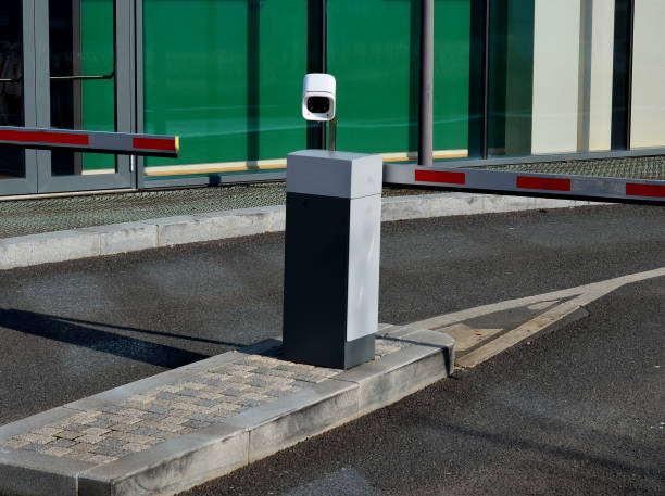 istock camera system makes it possible to recognize vehicle license plates with high accuracy in real time. The vehicle will arrive at barrier and it will roll up if vehicle's number plate has paid fee 1468510533
