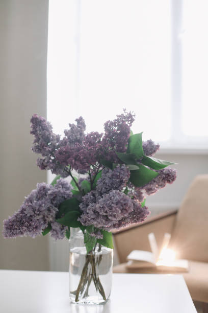 istock Home interior decor, bouquet of lilacs in a vase on table 1468510698
