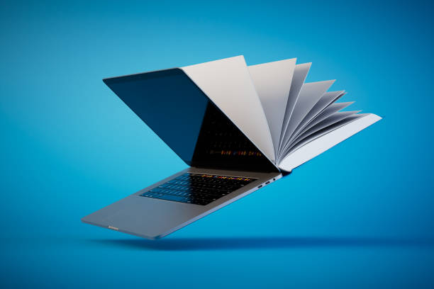 istock reading books online. Open book and laptop on a blue background. 3D render 1468510804