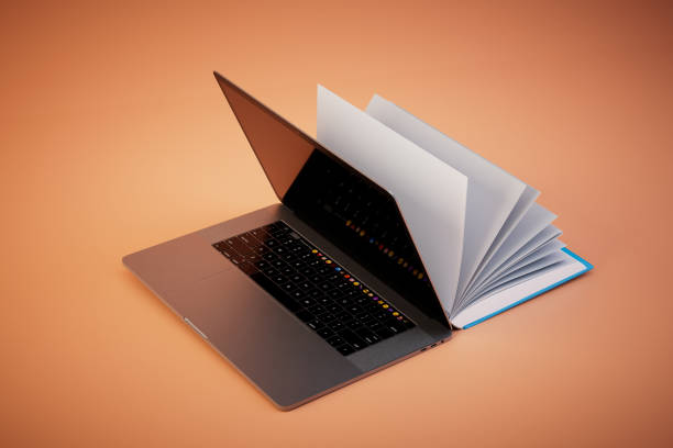 istock reading books online. Open book and laptop on a pastel background. 3D render 1468510815