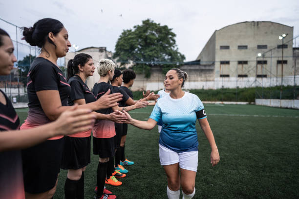 istock Female soccer players shaking hands before the match 1468511638