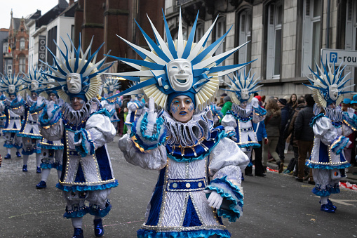 Aalst, Belgium, 19 February 2023: Group of identically costumed dancers in Aalst carnival street parade. Aalst hosts one of the biggest annual Mardi Gras celebrations in Belgium.