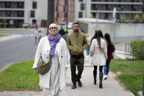 Woman walking on pavement