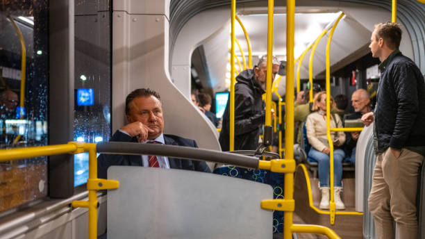 istock Businessmen sitting in bus 1468513722
