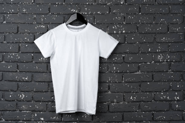istock White t-shirt hanging on hanger against brick wall 1468513779