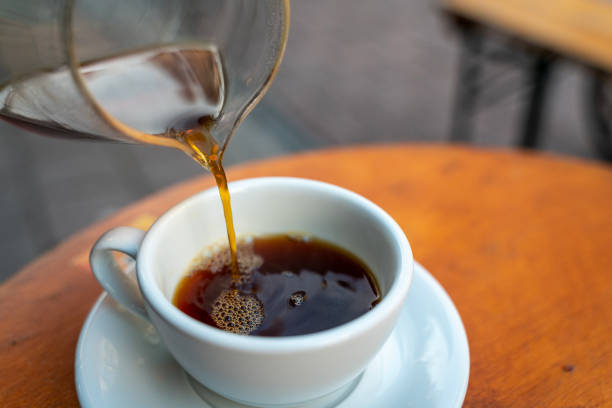 istock Pouring coffee from a V60 server into the favorite cup 1468514665