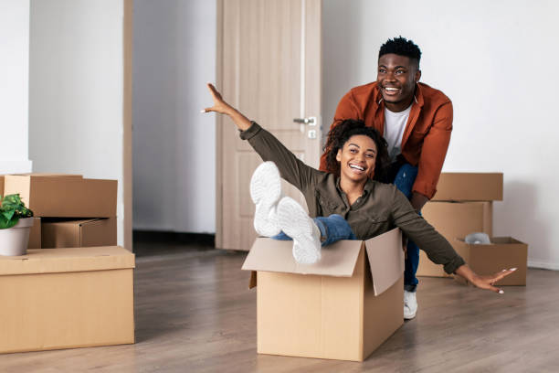istock Joyful Black Spouses Having Fun Celebrating Moving New Apartment 1468516592