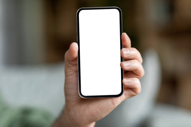istock Male Hand Holding Modern Smartphone With Big Blank White Screen 1468516622
