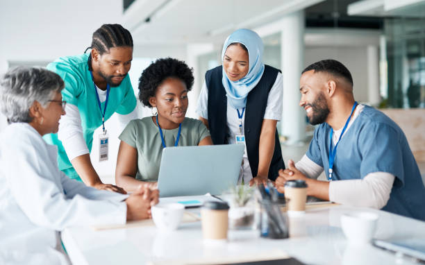 teamwork, planning and meeting with doctors and laptop for medical, review and healthcare. medicine, technology and internet with group of people for collaboration, diversity and support in hospital - medical occupation imagens e fotografias de stock