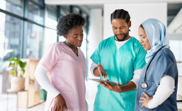 istock Tablet, diversity or doctors in a meeting for surgery planning or strategy in collaboration together in hospital. Black people, talking or healthcare nurses working on bone anatomy for solutions 1468520277