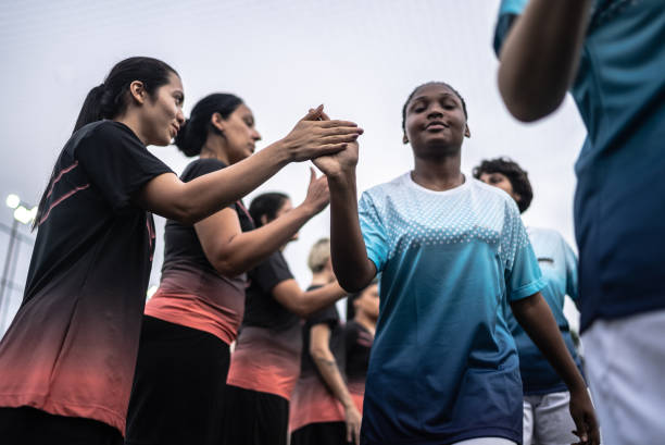 istock Female soccer players shaking hands before the match 1468520467