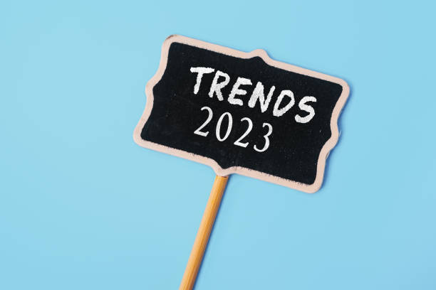 istock TRENDS 2023 - text on a small chalkboard on a blue background. Top view. Business management, Inspiration to success ideas 1468521431