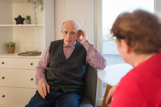 istock Elderly man talking with his wife and having hearing loss issues 1468521713