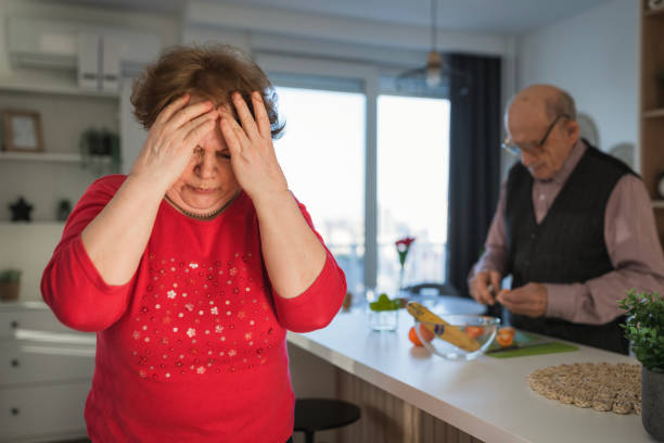 istock Woman with head in hands having a headache 1468521833