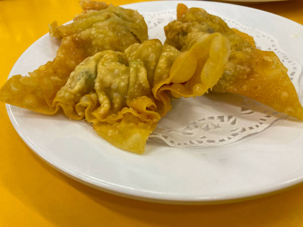 istock Deep fried gyoza crispy and golden colour set on white plate 1468522378
