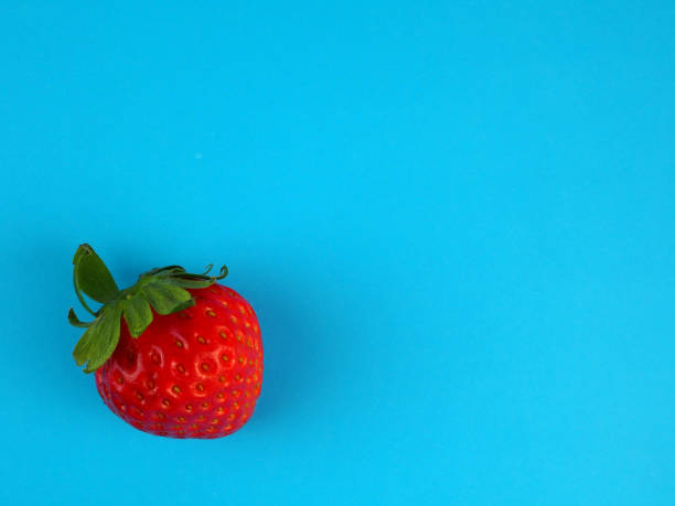 istock Juicy, fresh strawberry on a blue background. 1468522688