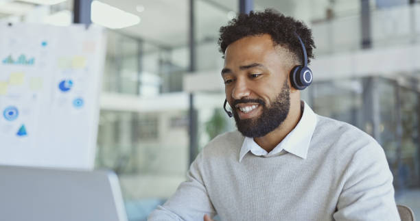 istock Callcenter, customer service or black man on laptop for support, consulting or networking in office. Manager, CRM or sales advisor on tech for telemarketing, research or contact us help with smile 1468522707