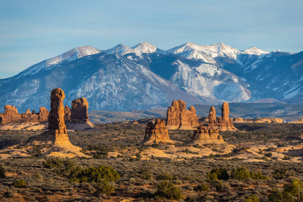 istock Rock formations with distant snow-covered mountains in the distance 1468523571