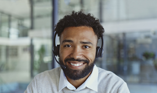 Face of black man, call center consultation or telemarketing agent in technical support for ecommerce IT career. Virtual help desk portrait of information technology person in USA business consulting