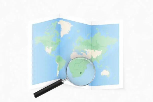 Vector illustration of Enlarge Lesotho with a magnifying glass on a folded map of the world.