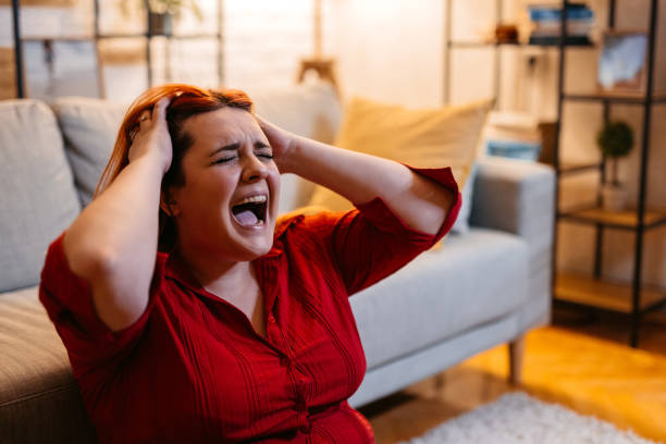 istock Depressed Young Woman Screaming At Home 1468528482