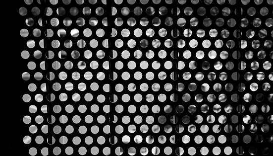 black and white perforated metal surface