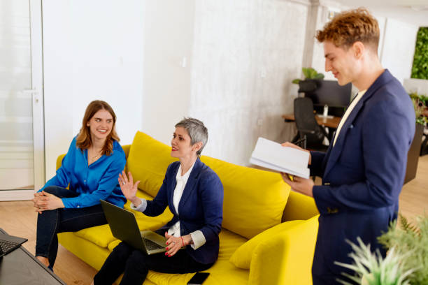 Cheerful business people talking about new ideas in the modern office