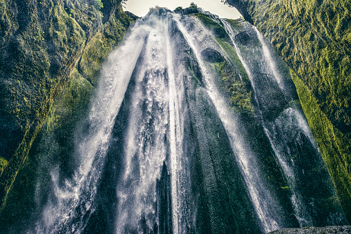Gljúfrabúi (or Canyon Dweller) waterfall located at Hamragarðar in South Iceland, close tothe famous Seljalandsfoss. The waterfall is hidden behind a cliff where the Gljúfurá stream, runs through a cleft in the cliff.