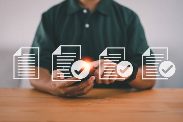 istock Man using smartphone with e-doc icons, online management, paperless office concept. 1468533084