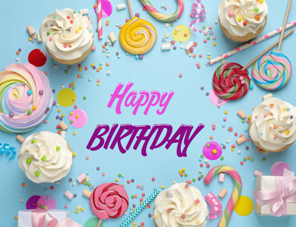 istock Happy Birthday. Flat lay composition with tasty cupcakes on light blue background 1468536059
