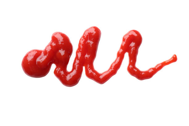 istock Tasty ketchup isolated on white, top view 1468536282