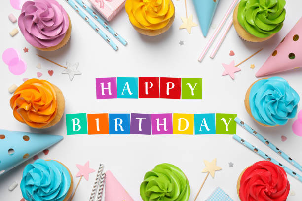 istock Happy Birthday. Flat lay composition with colorful cupcakes on white background 1468536506