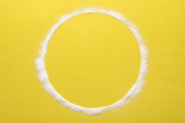 istock Frame made of granulated sugar on yellow background, top view. Space for text 1468536992
