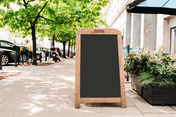 Blank advertising board on city street. Space for design