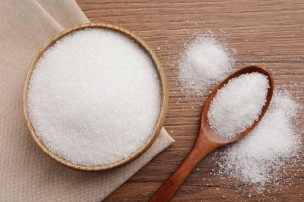 istock Granulated sugar on wooden table, flat lay 1468537651