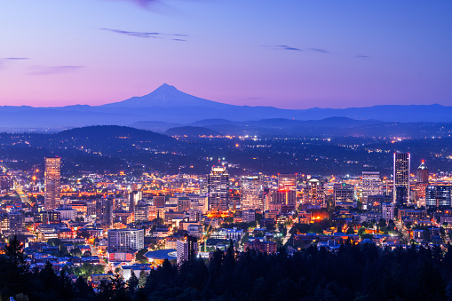 Portland, Oregon, USA skyline at dawn with Mt. Hood in the distance at dawn.