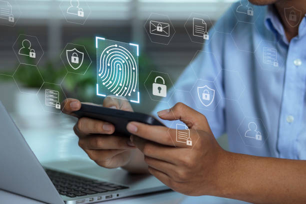 istock A user accesses document data via a laptop and smartphone equipped with a fingerprint scanner. Cyber security and data protection information privacy internet technology 1468539685