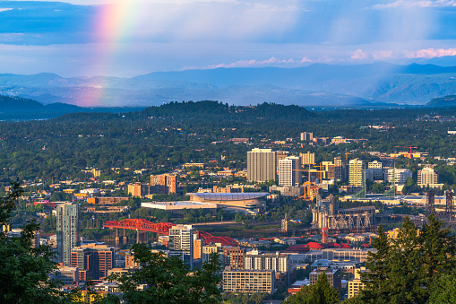Portland, Oregon, USA downtown cityscape with a sun shower and rainbow.