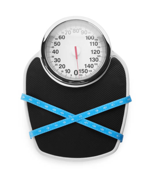 istock Scales and measuring tape isolated on white, top view 1468541173