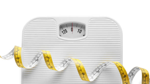 istock Scales and measuring tape isolated on white, top view 1468542040