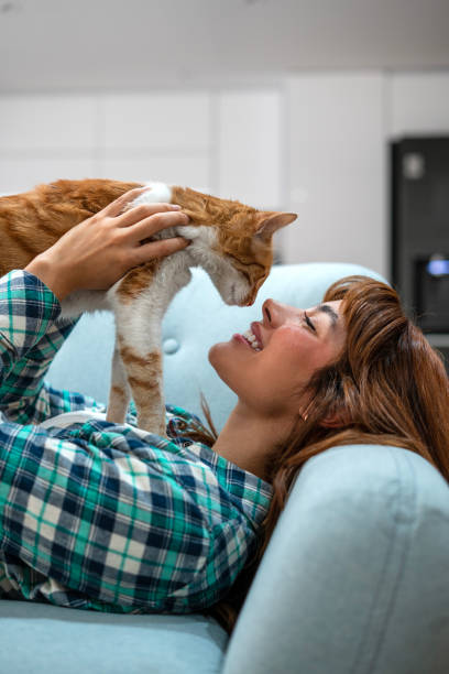 istock Woman spending time with her cat at home 1468542752
