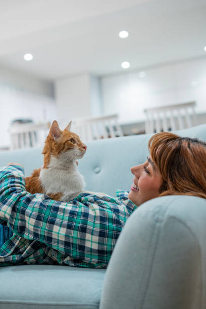 istock Woman spending time with her cat at home 1468543824