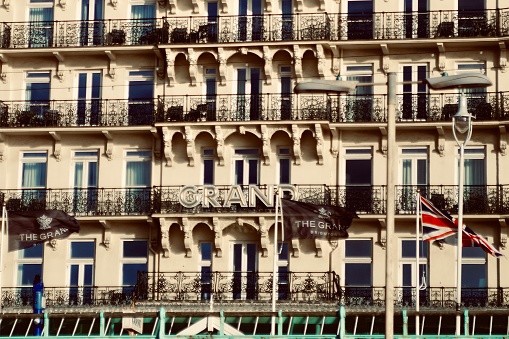 White victorian building with focus on symmetry in the windows.  Captured at Grand Hotel in Brighton on the 15th January 2023