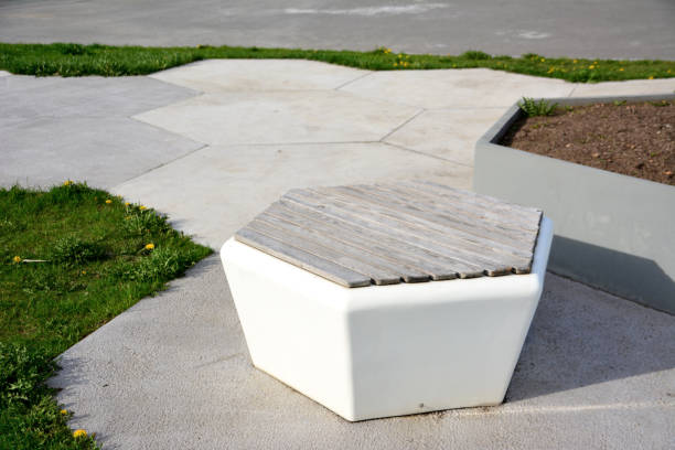 istock white hexagon bench isolated on concrete pathway in public park, close-up 1468554680