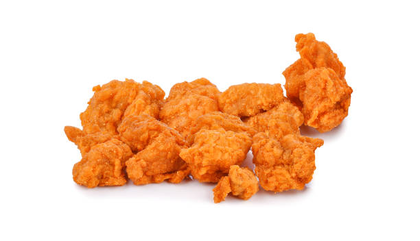 istock Fried spicy popcorn chicken isolated on white 1468555151