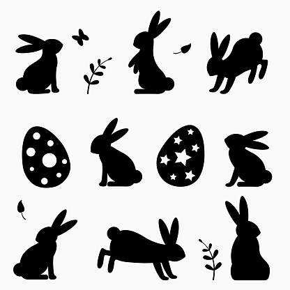 A set of silhouettes of easter bunnies and easter eggs.