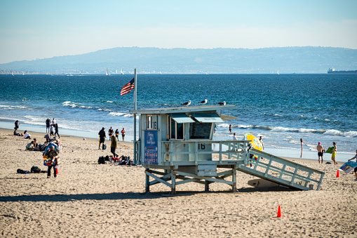 Los Angeles, California, USA - November 12, 2022: Close-up of Los Angeles iconic lifeguard tower on the beach at Santa Monica.